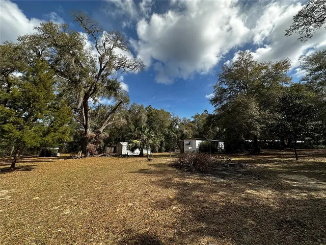 a view of road with trees