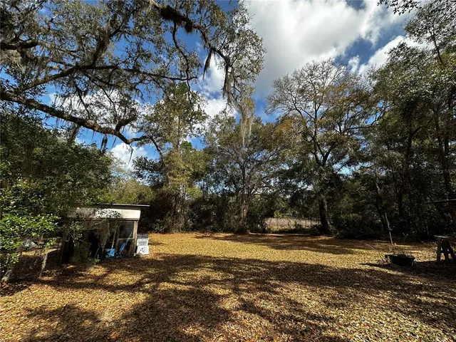 a view of backyard with outdoor space