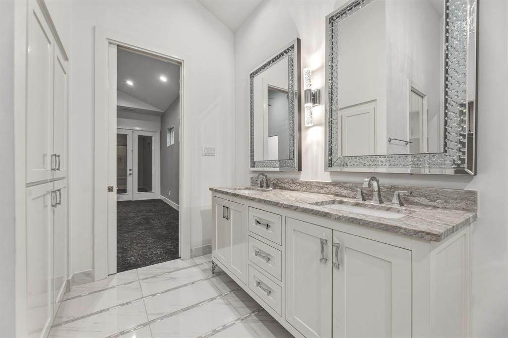 1515 North Fielder Road Arlington, TX 76012 - Photo 22 of 35 a bathroom with a granite countertop sink and a mirror