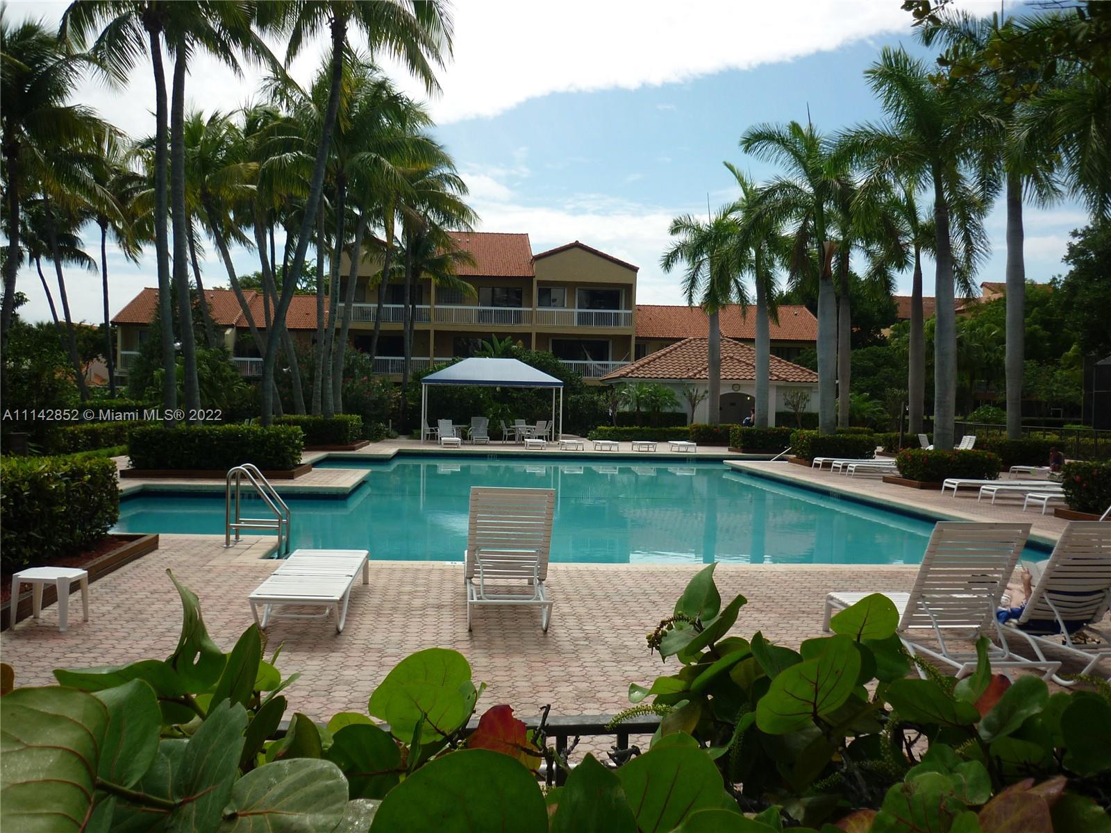 Aventura Aventura, FL 33180 - Photo 13 of 29 a view of a swimming pool with chairs and table in the patio