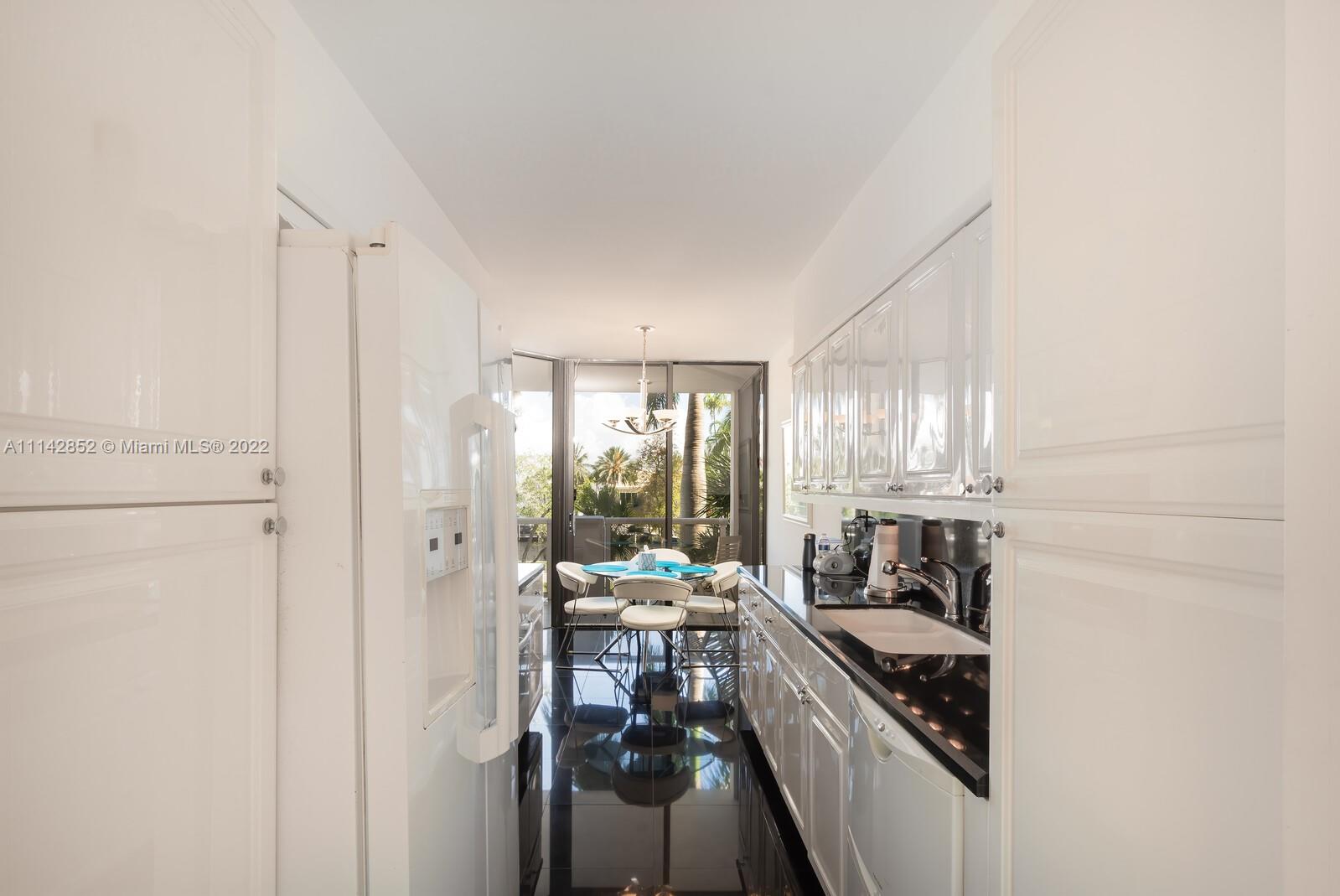 Aventura Aventura, FL 33180 - Photo 22 of 29 a kitchen with a stove a refrigerator and windows