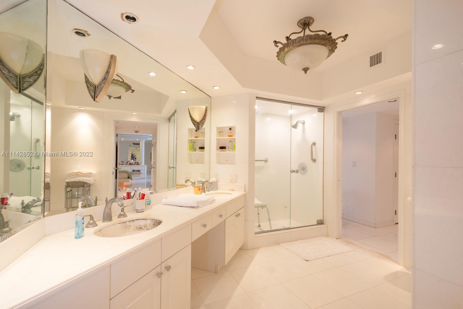 Aventura Aventura, FL 33180 - Photo 24 of 29 a spacious bathroom with a double vanity sink mirror and shower