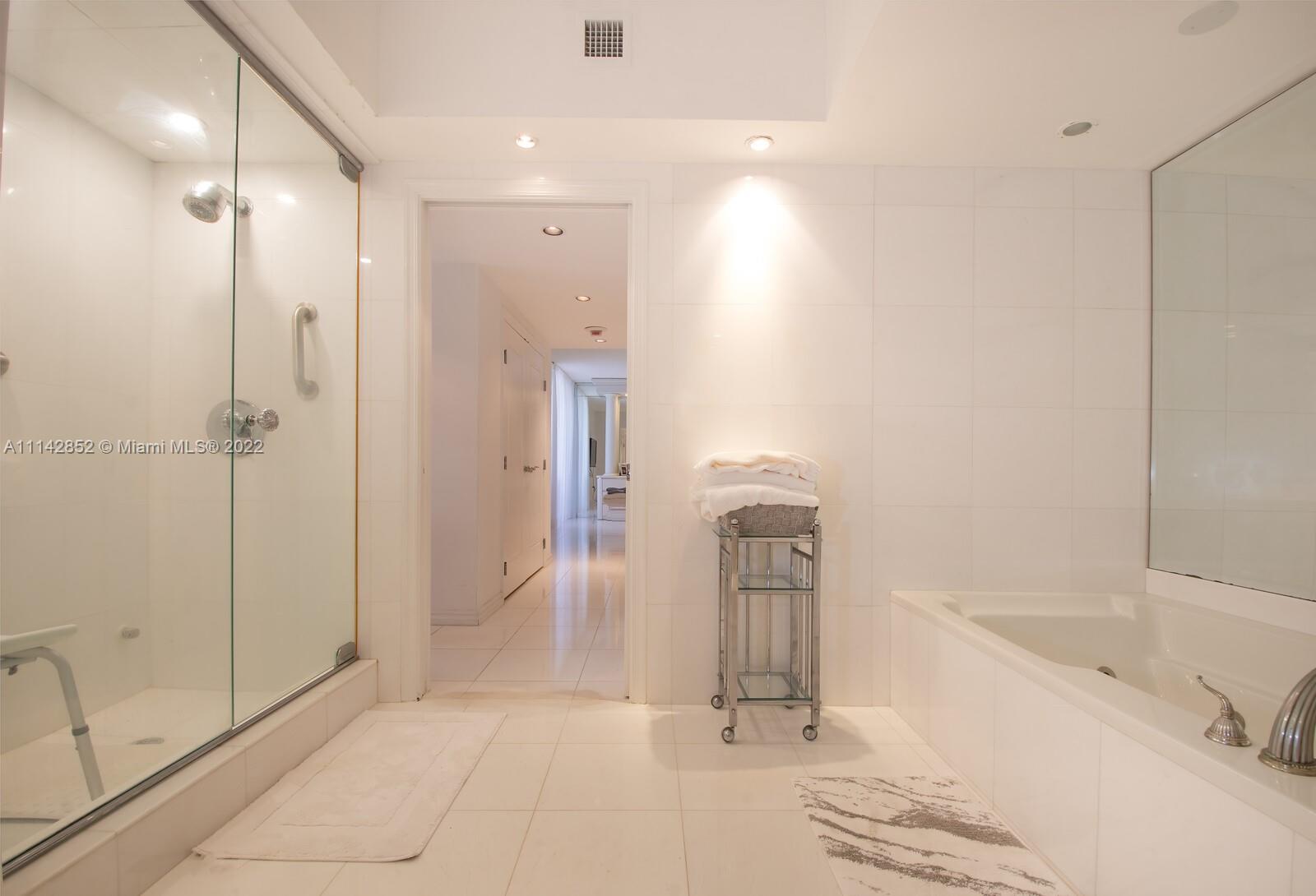 Aventura Aventura, FL 33180 - Photo 25 of 29 a bathroom with a bathtub and a shower