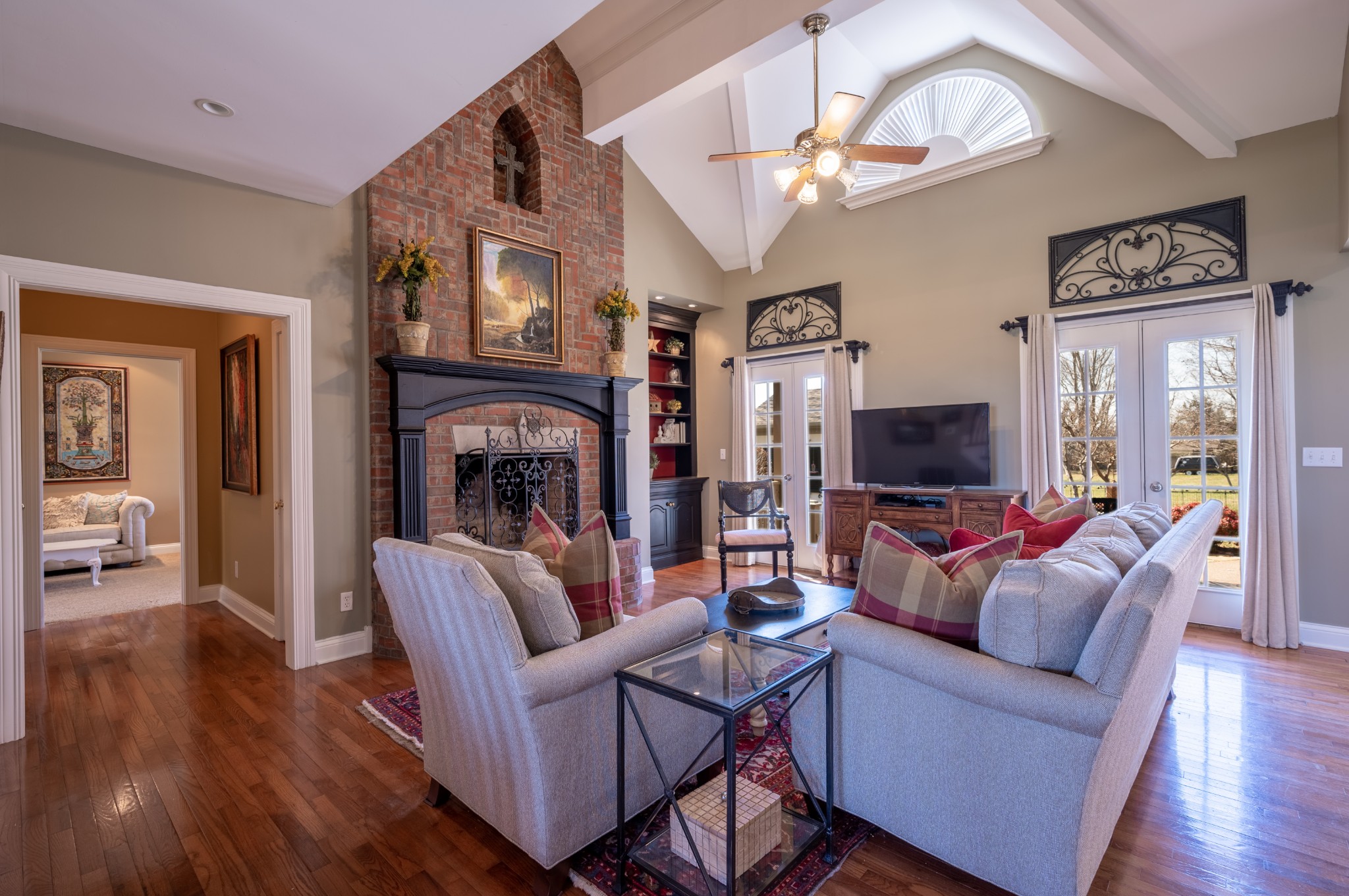 4335 North Chapel Road Franklin, TN 37067 - Photo 15 of 55 a living room with furniture a ceiling fan and a flat screen tv
