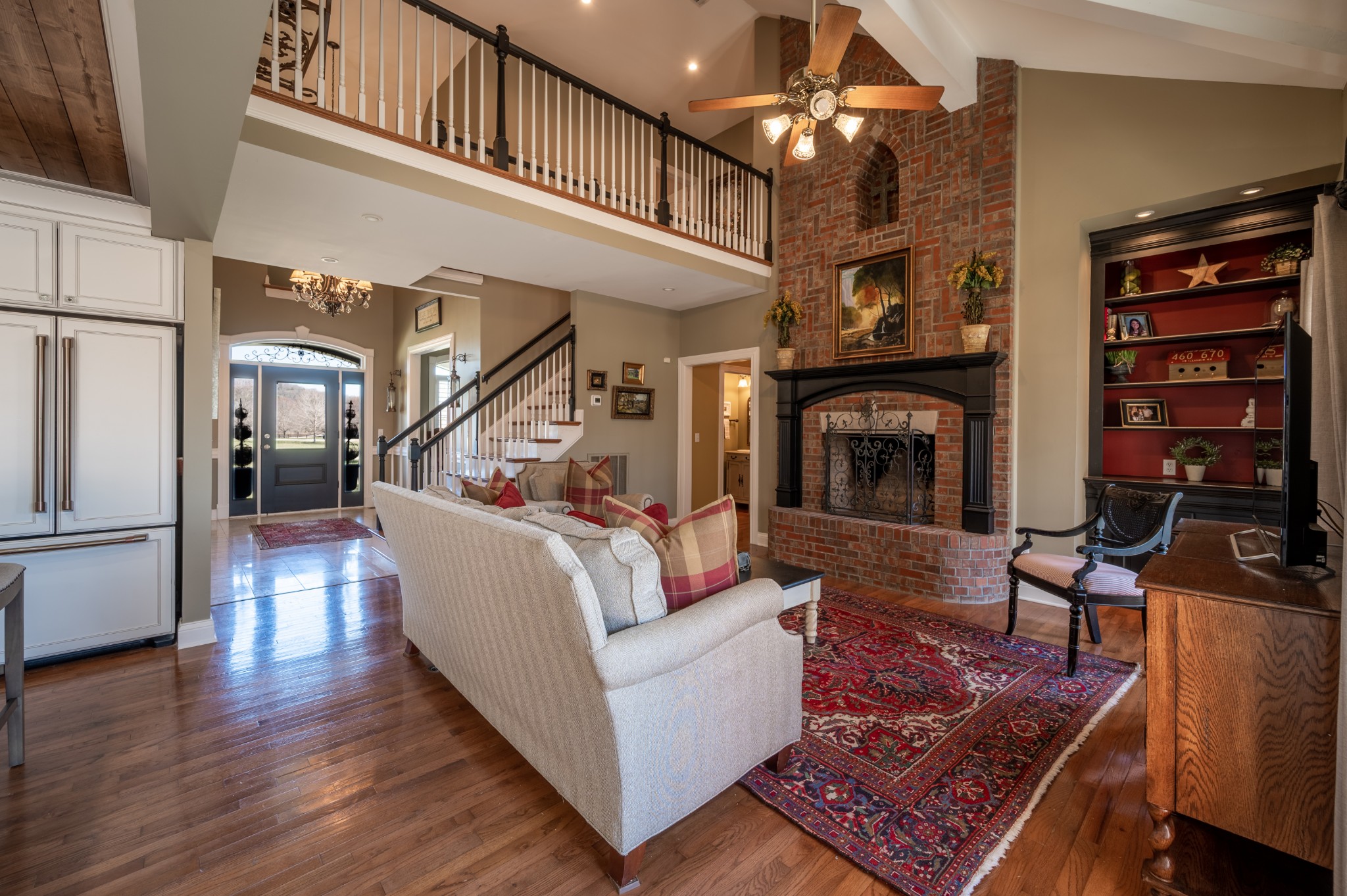 4335 North Chapel Road Franklin, TN 37067 - Photo 16 of 55 a living room with furniture a fireplace and a chandelier