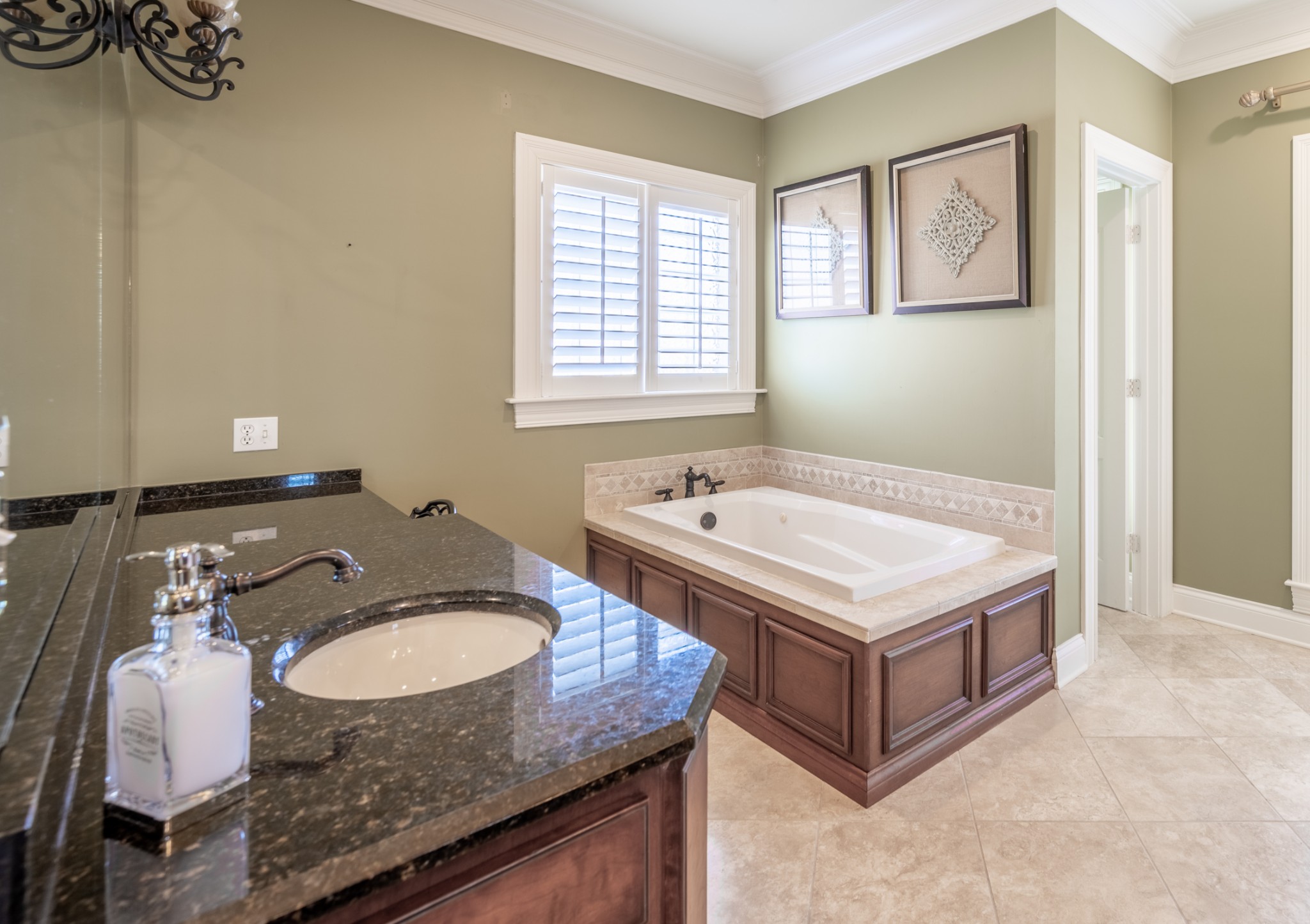 4335 North Chapel Road Franklin, TN 37067 - Photo 25 of 55 a bathroom with a granite countertop sink a mirror and a bathtub