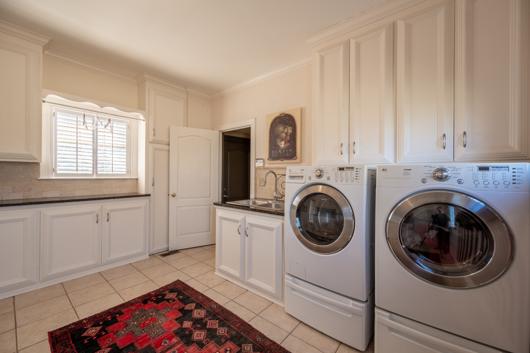 4335 North Chapel Road Franklin, TN 37067 - Photo 49 of 55 a utility room with sink dryer and washer