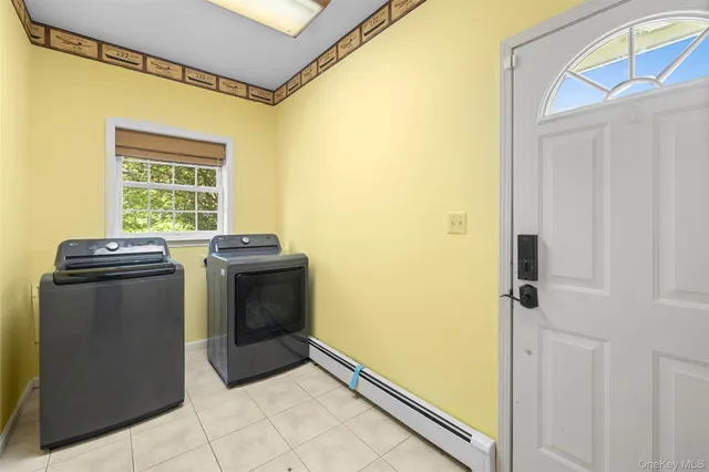 a utility room with washer and dryer