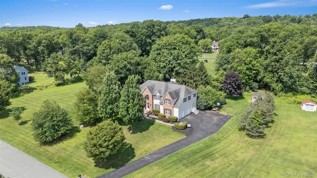 a view of a garden with a building in the background