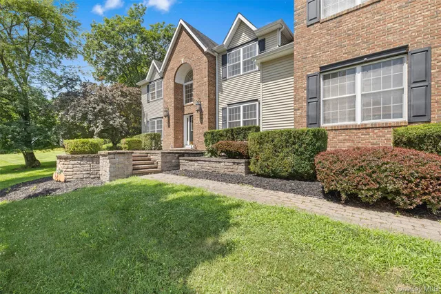 a house view with a garden space