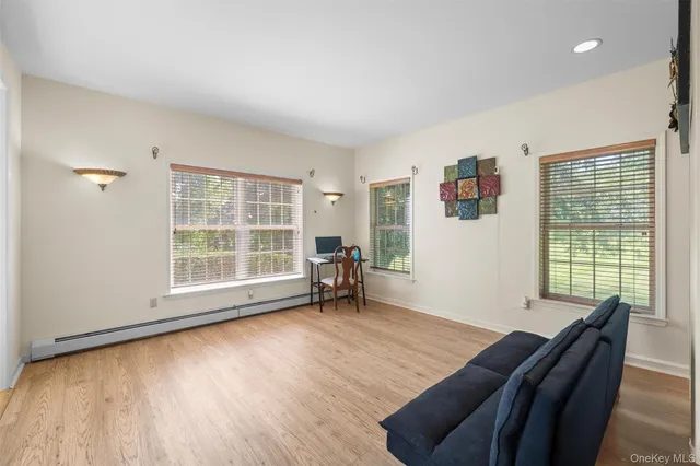 a view of a livingroom with furniture and wooden floor