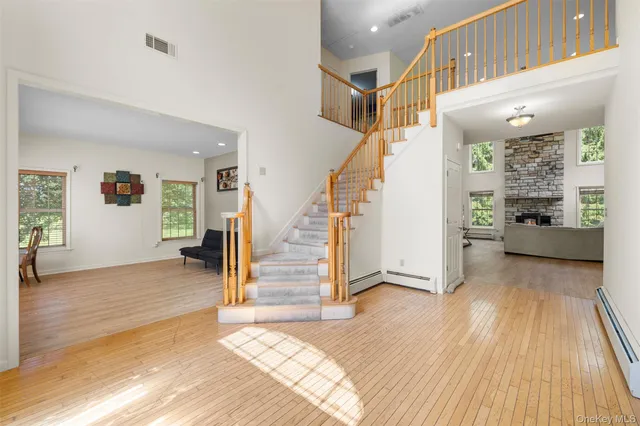 a view of entryway with livingroom and wooden floor