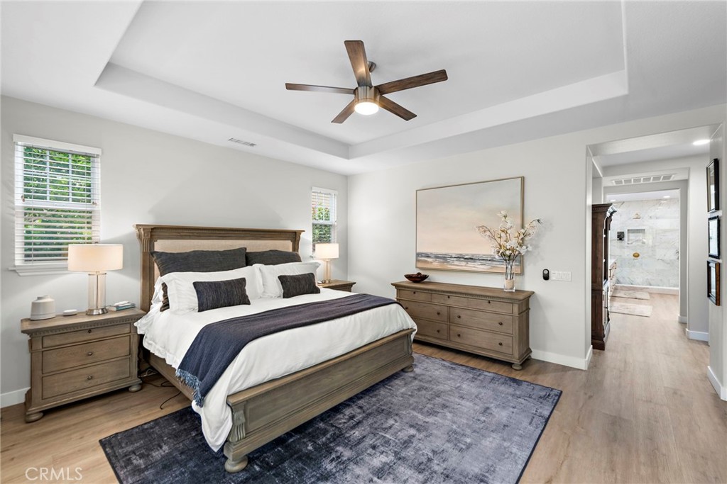 20 Becker Drive Ladera Ranch, CA 92694 - Photo 20 of 47 a bedroom with a large bed and a chandelier