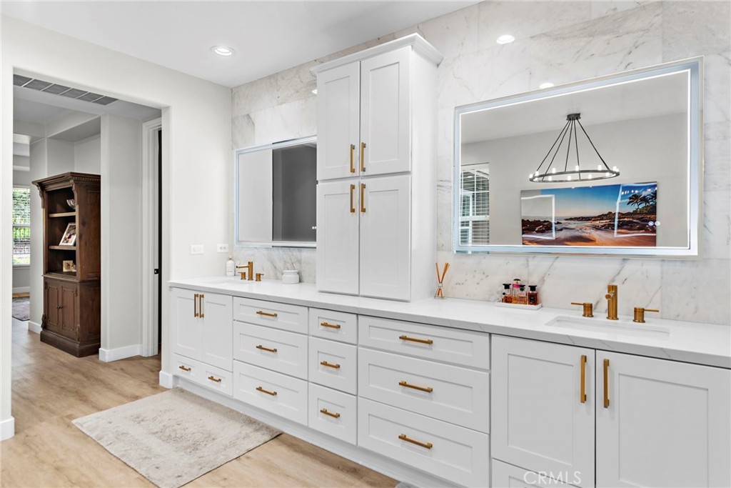 20 Becker Drive Ladera Ranch, CA 92694 - Photo 24 of 47 a bathroom with a sink vanity and mirror