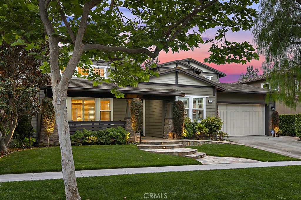 20 Becker Drive Ladera Ranch, CA 92694 - Photo 33 of 47 a front view of a house with a garden and yard