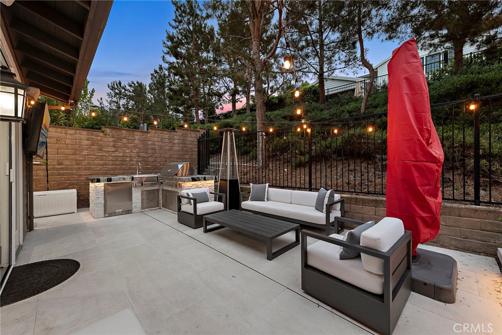 20 Becker Drive Ladera Ranch, CA 92694 - Photo 4 of 47 a view of a patio with couches table and chairs and potted plants