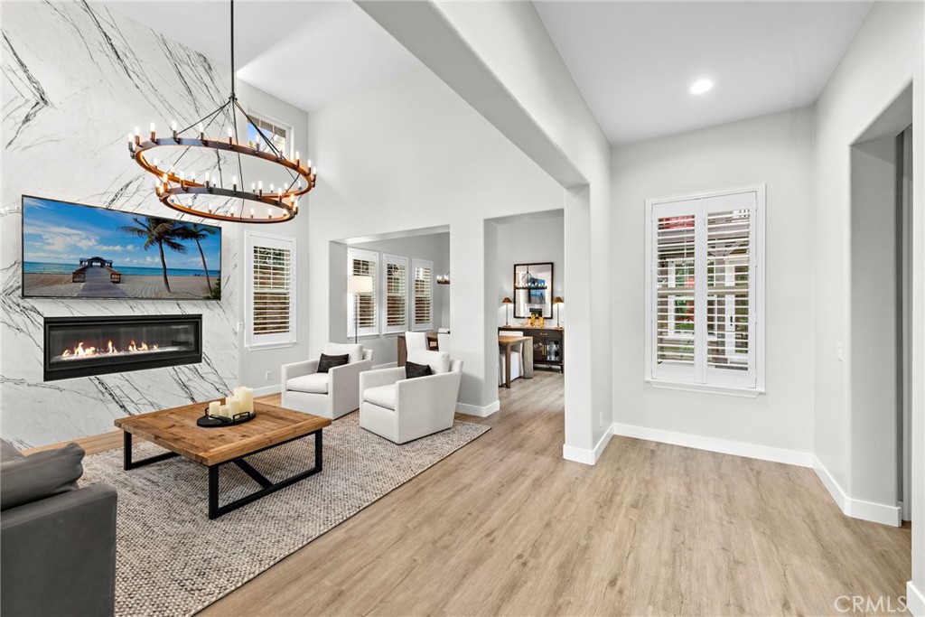 20 Becker Drive Ladera Ranch, CA 92694 - Photo 6 of 47 a living room with furniture a window and a chandelier