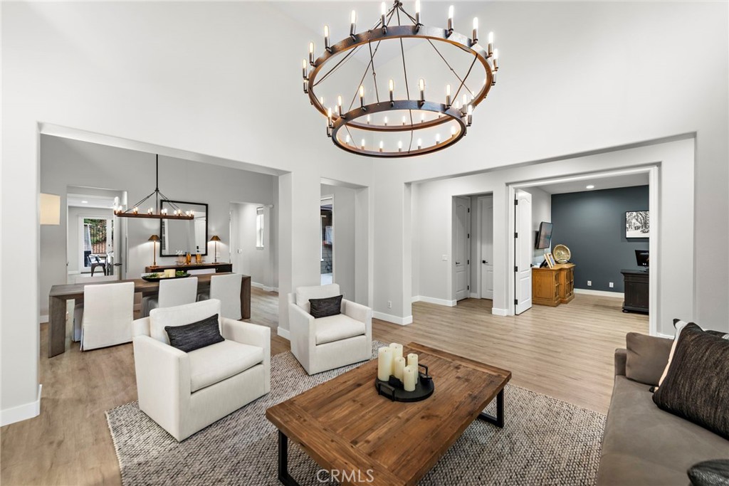 20 Becker Drive Ladera Ranch, CA 92694 - Photo 8 of 47 a living room with furniture a dining table and a chandelier