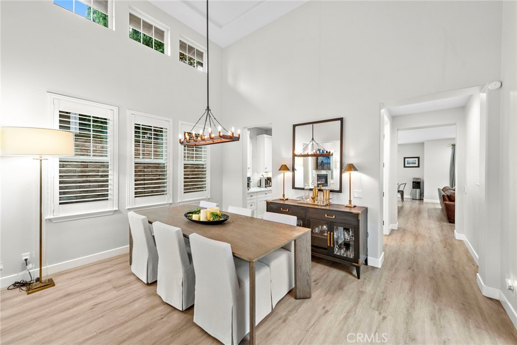20 Becker Drive Ladera Ranch, CA 92694 - Photo 9 of 47 a view of a dining room with furniture window and wooden floor