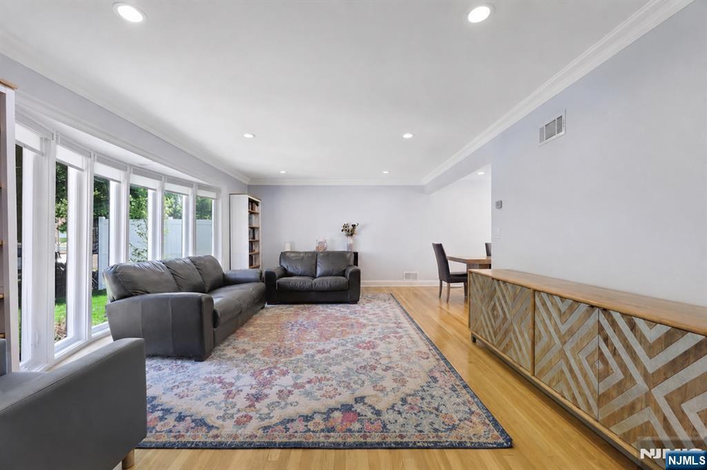 514 Rutland Avenue Teaneck, NJ 07666 - Photo 6 of 40 a living room with furniture rug and a table