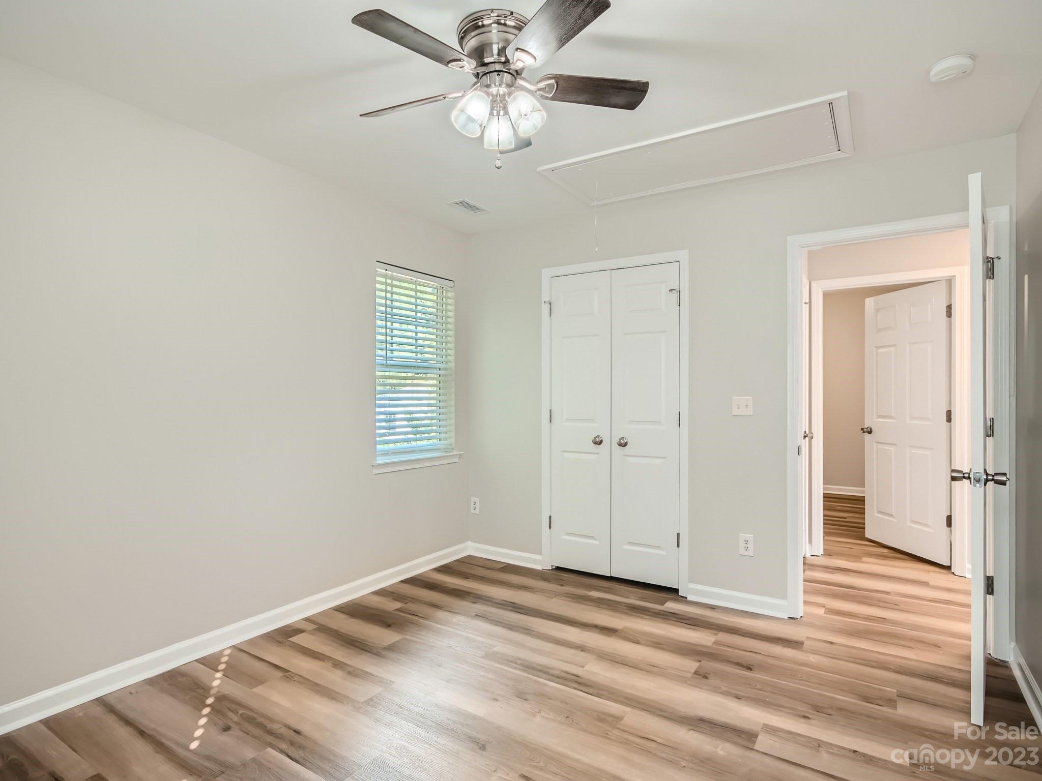 6608 Love Ridge Lane Charlotte, NC 28213 - Photo 15 of 28 a view of a livingroom with a ceiling fan and wooden floor