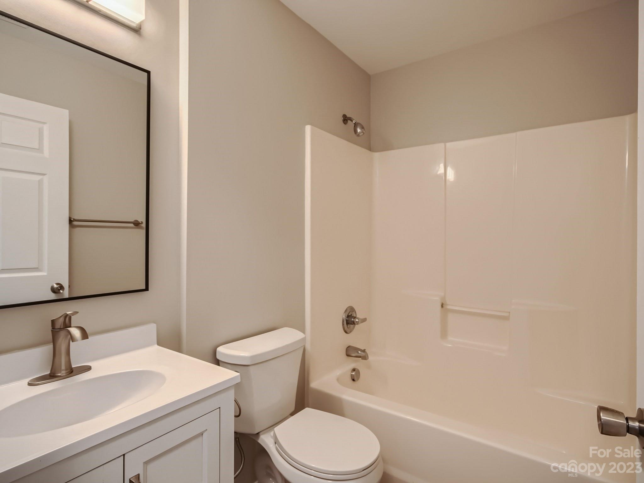 6608 Love Ridge Lane Charlotte, NC 28213 - Photo 16 of 28 a bathroom with a sink a toilet and shower