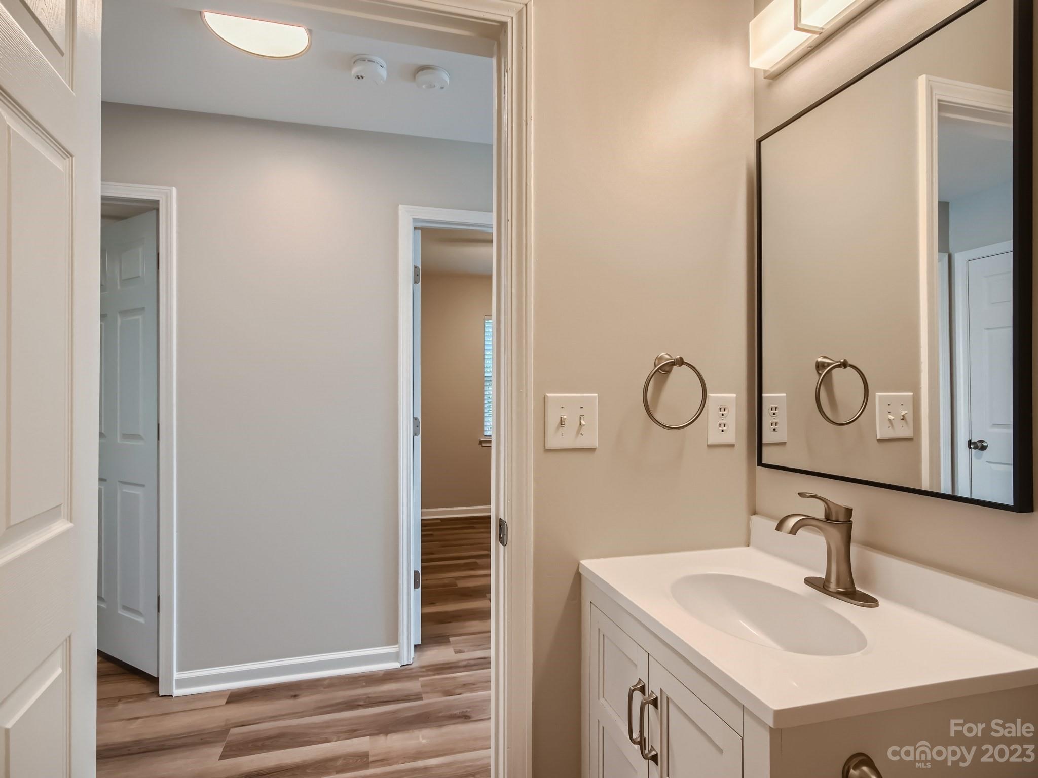 6608 Love Ridge Lane Charlotte, NC 28213 - Photo 17 of 28 a bathroom with a sink and a mirror