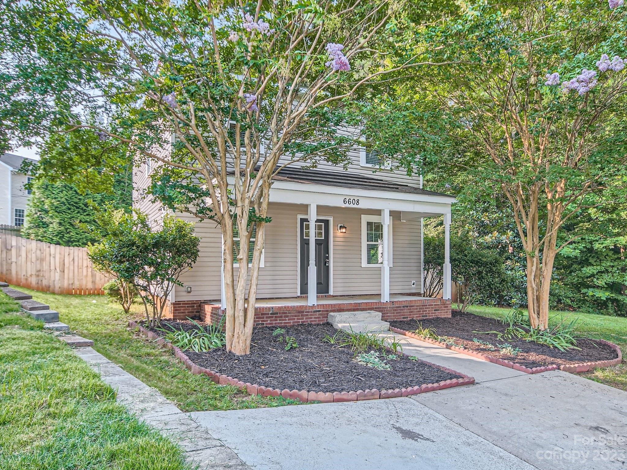6608 Love Ridge Lane Charlotte, NC 28213 - Photo 2 of 28 a front view of a house with garden