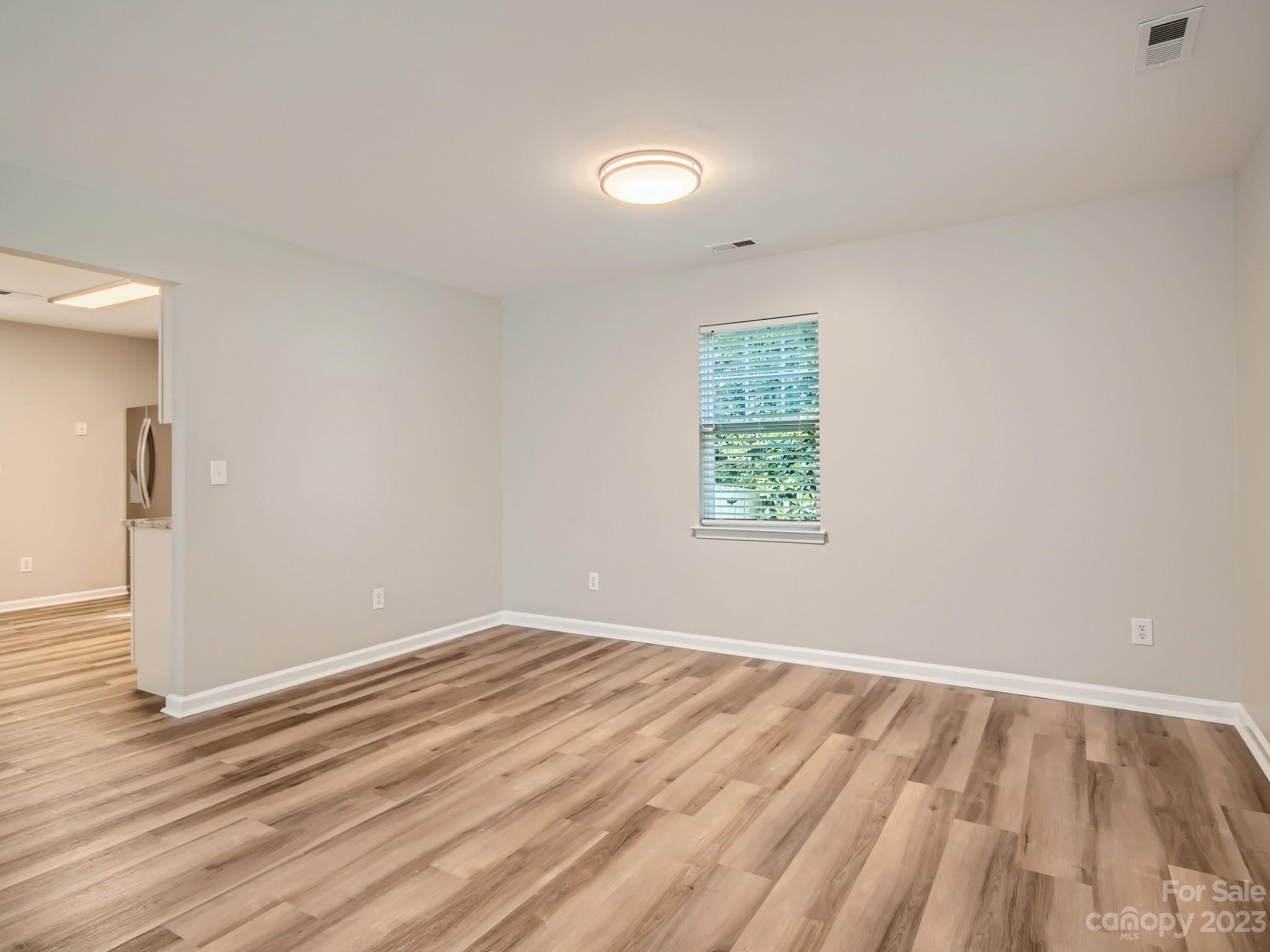 6608 Love Ridge Lane Charlotte, NC 28213 - Photo 24 of 28 wooden floor in an empty room with a window