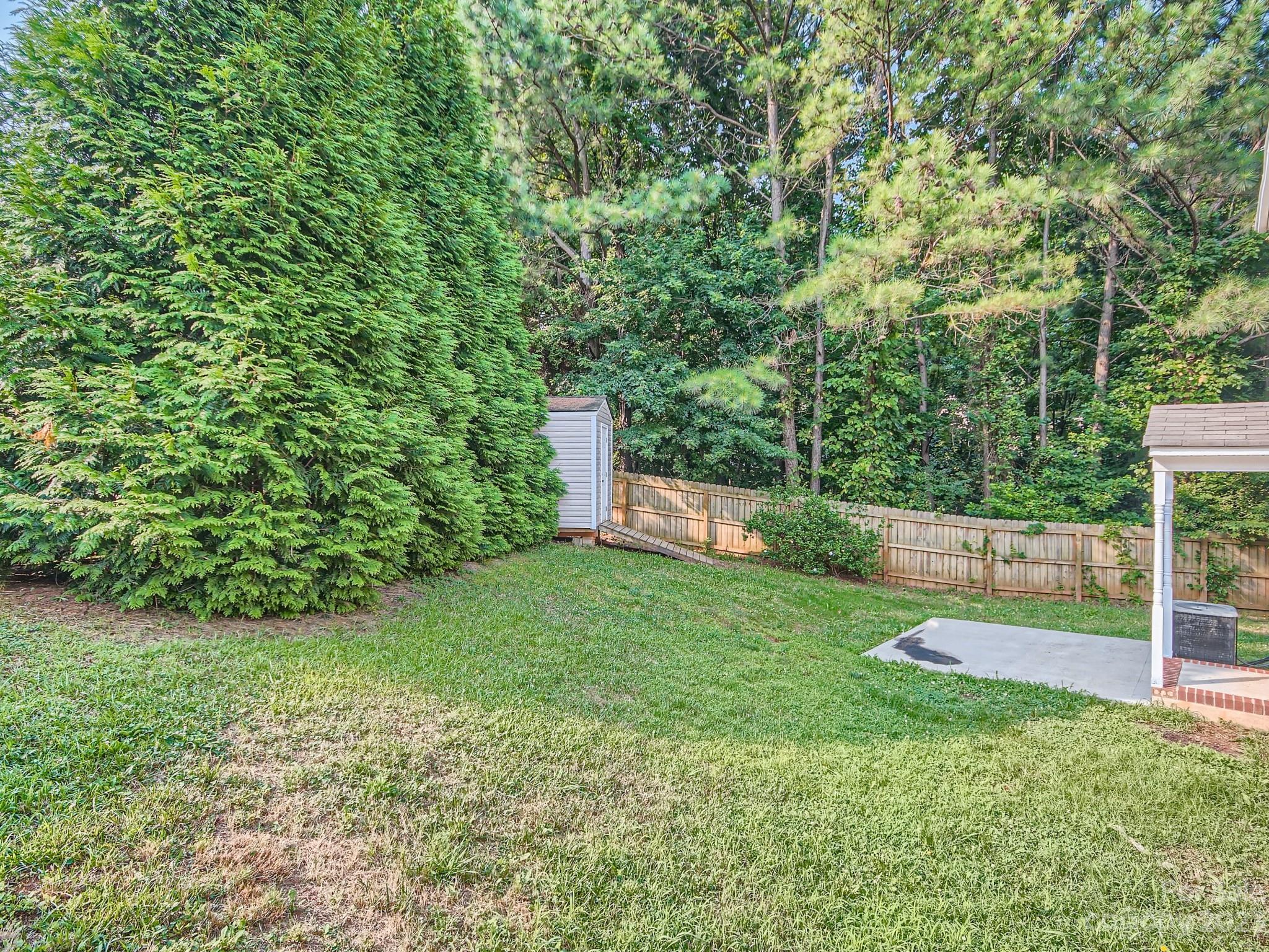6608 Love Ridge Lane Charlotte, NC 28213 - Photo 26 of 28 a view of a backyard with a small garden