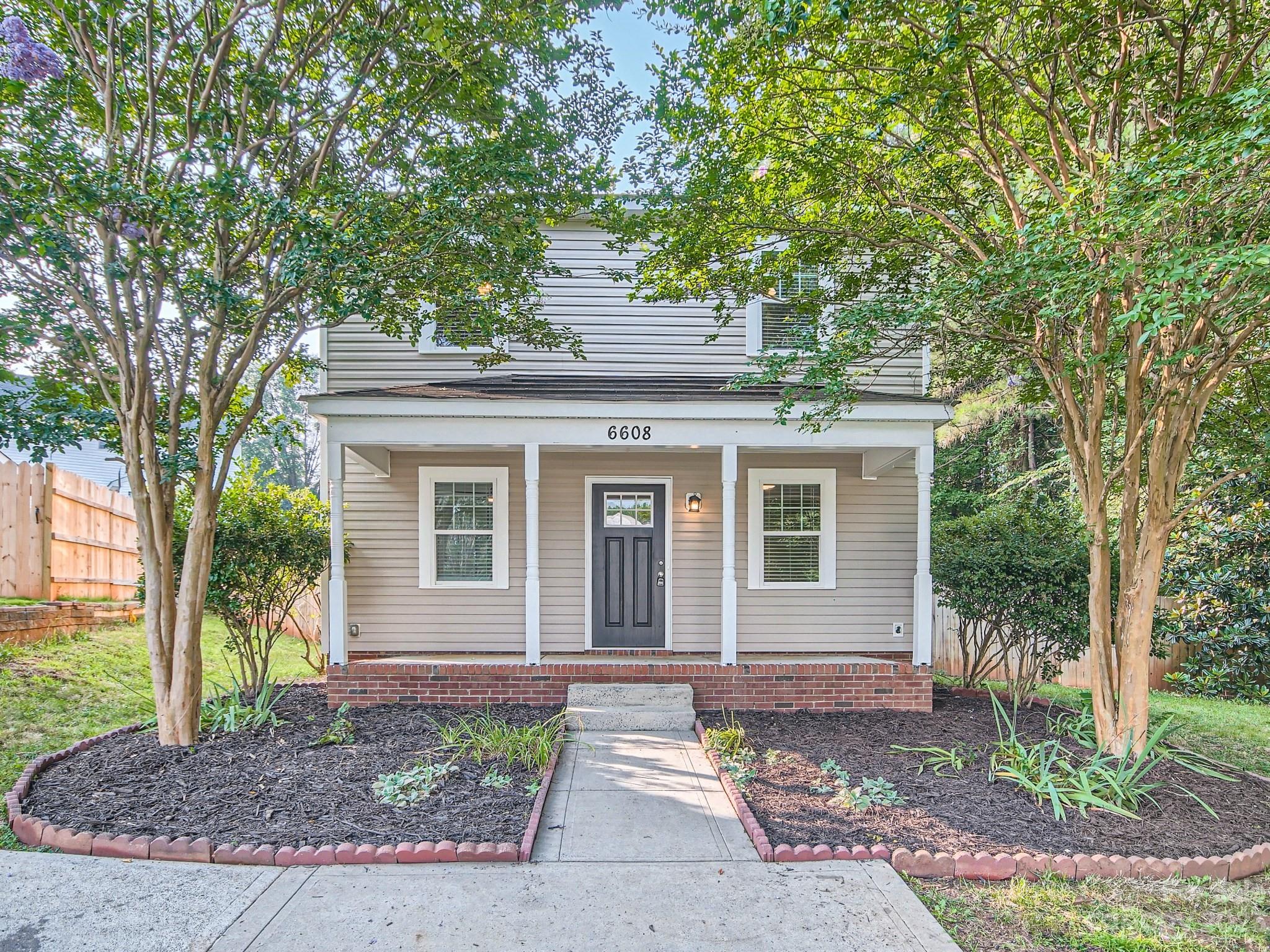 6608 Love Ridge Lane Charlotte, NC 28213 - Photo 3 of 28 a front view of a house with garden