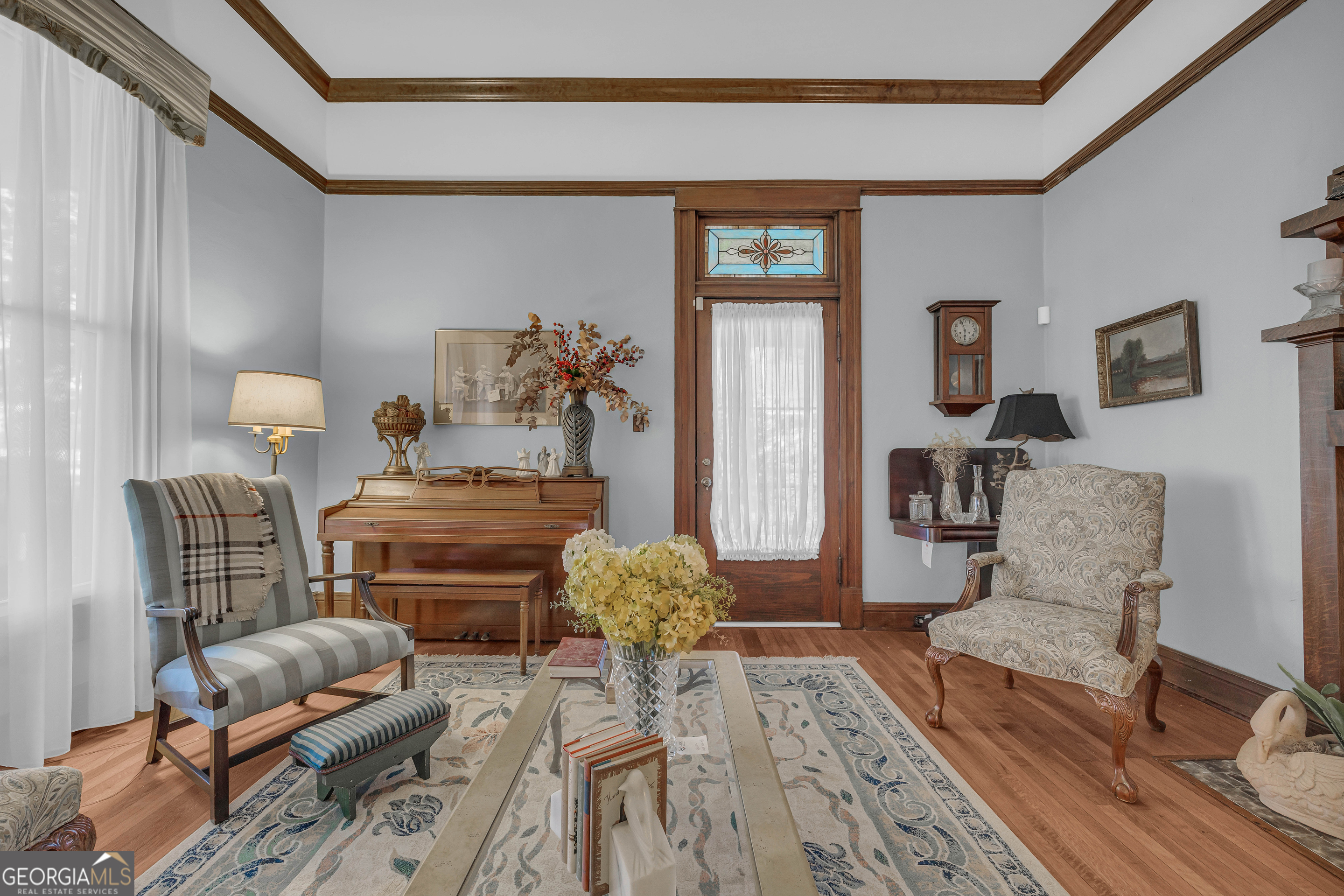 105 South Thomas Street Elberton, GA 30635 - Photo 13 of 57 a bedroom with furniture and wooden floor