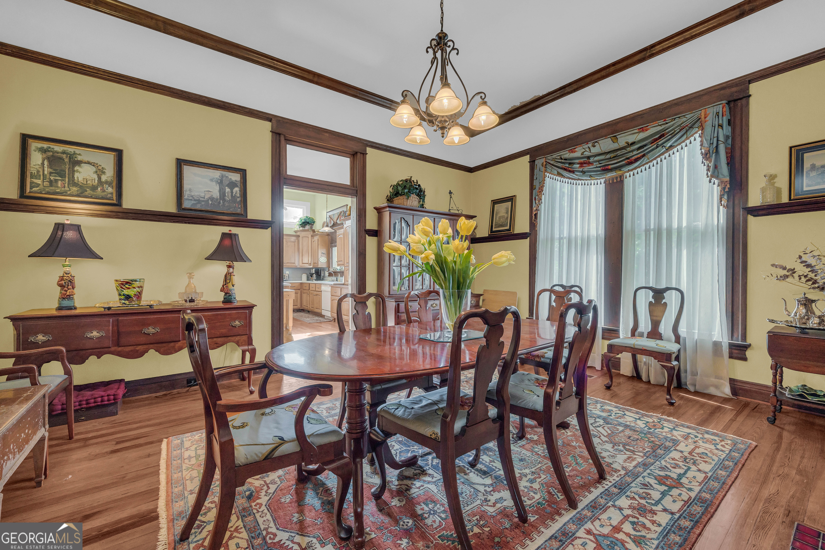 105 South Thomas Street Elberton, GA 30635 - Photo 22 of 57 a view of a dining room with furniture window and wooden floor