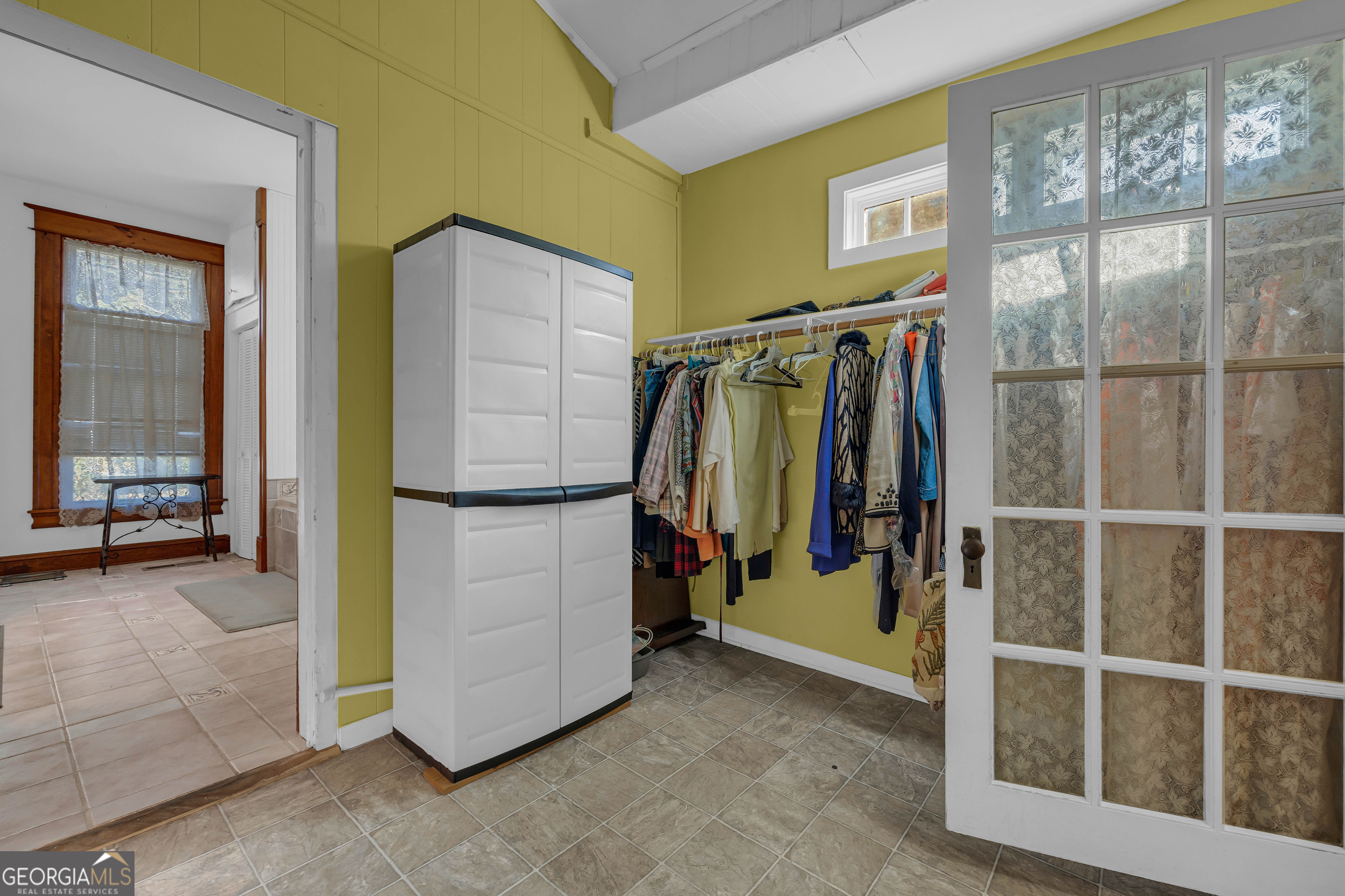 105 South Thomas Street Elberton, GA 30635 - Photo 37 of 57 a view of walk in closet with clothes and shoes