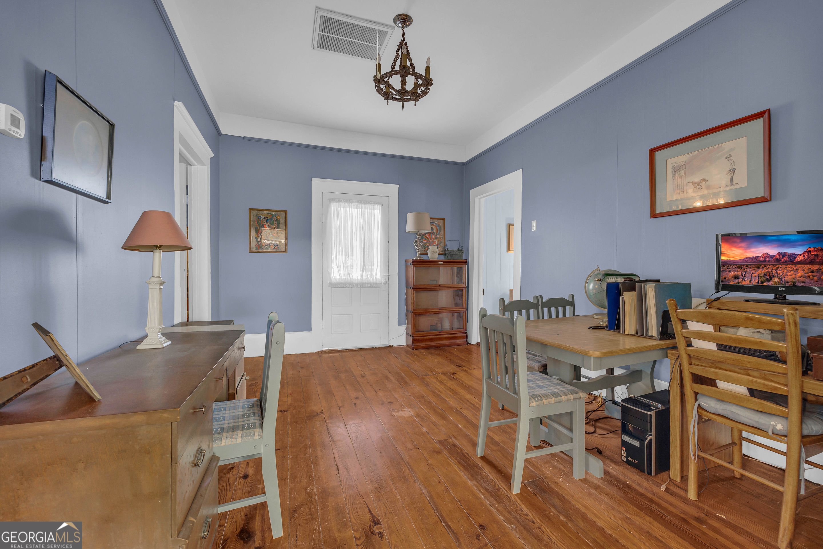 105 South Thomas Street Elberton, GA 30635 - Photo 39 of 57 a view of a dining room with furniture and wooden floor