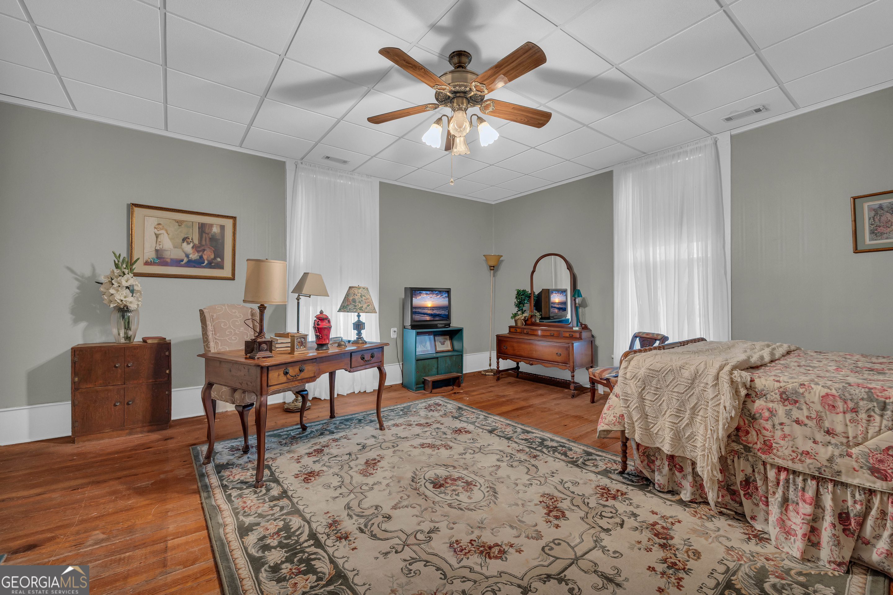 105 South Thomas Street Elberton, GA 30635 - Photo 44 of 57 a bedroom with furniture and a large window