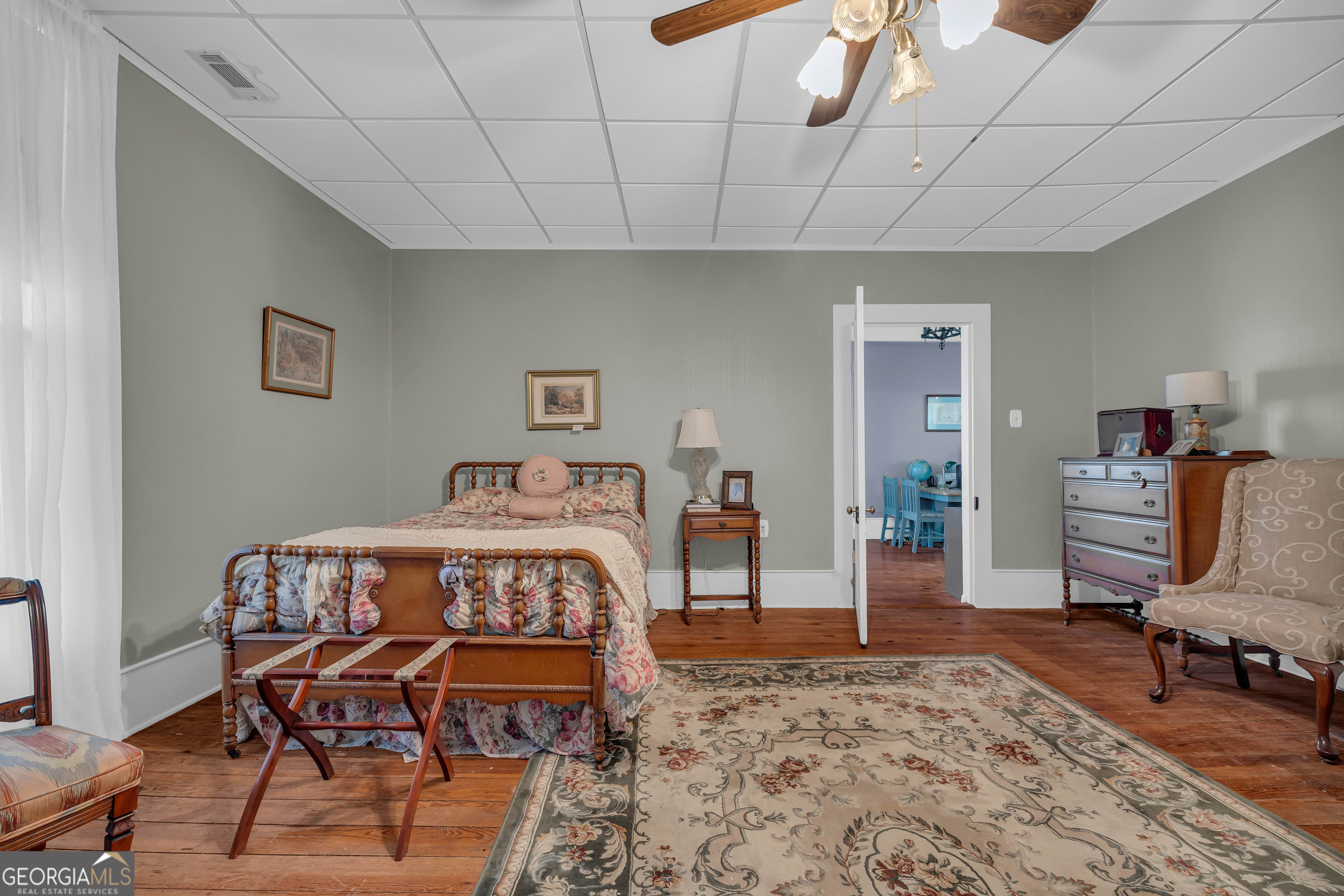 105 South Thomas Street Elberton, GA 30635 - Photo 45 of 57 a bedroom with a bed a chair and dresser