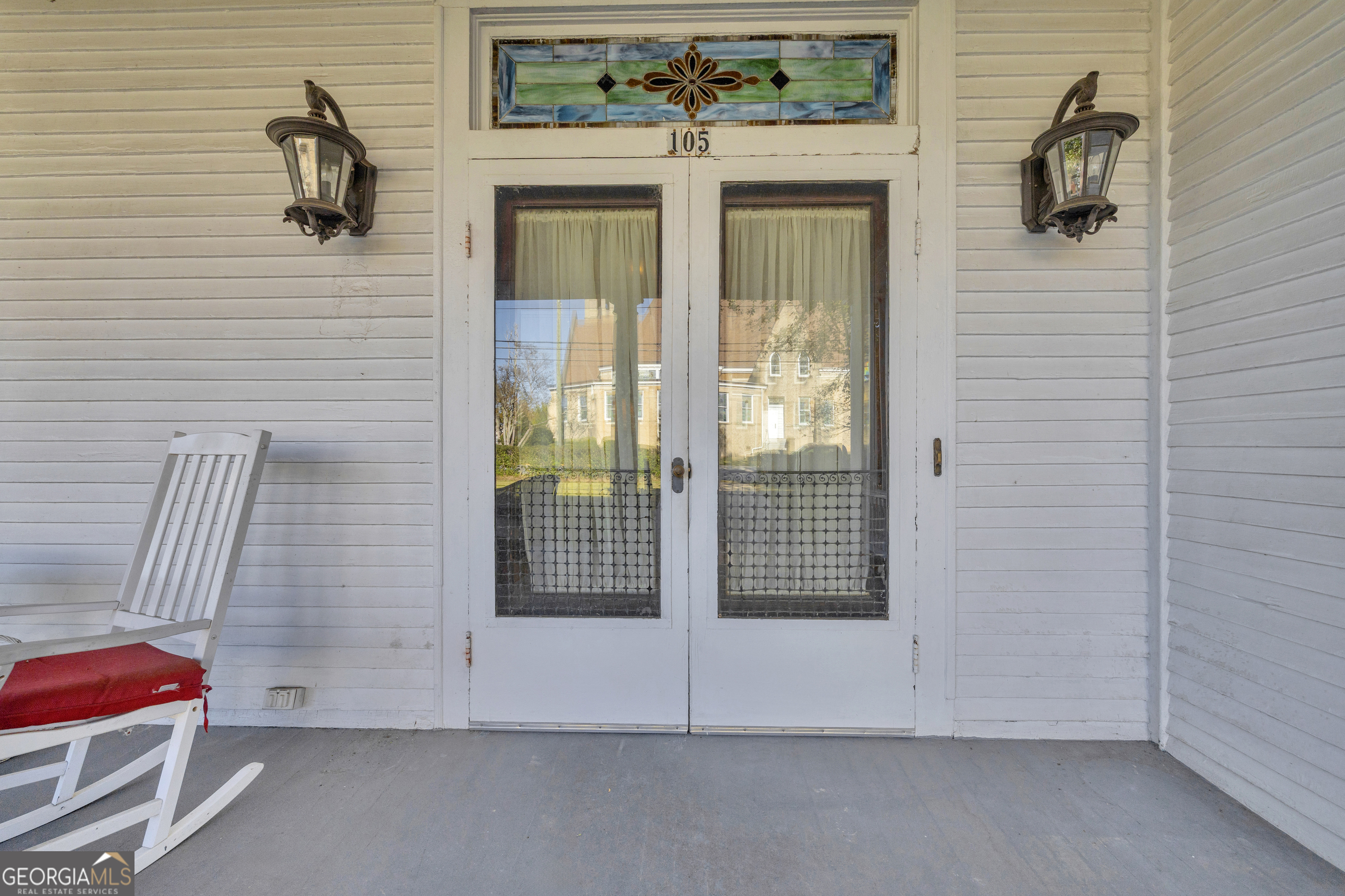 105 South Thomas Street Elberton, GA 30635 - Photo 6 of 57 a view of a door and chair in the room