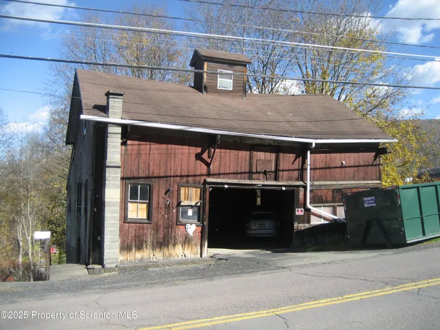 a front view of a house with garage