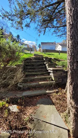 a view of a backyard of the house