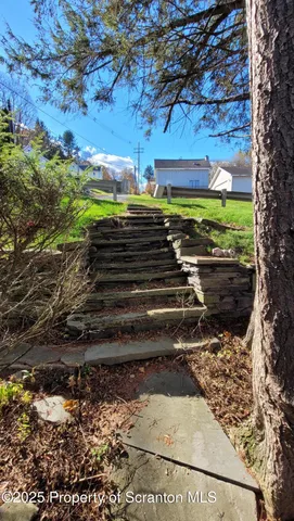 a view of a backyard of the house