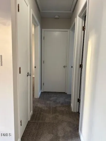 a view of a hallway with a shower