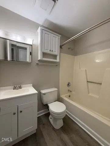 a bathroom with a toilet a sink and a bathtub