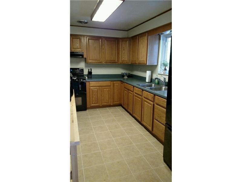 320 Limerick Road Wexford, PA 15090 - Photo 3 of 19 Kitchen. Kitchen with new gas oven and refrigerator with access to wrap around deck