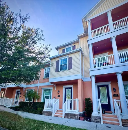 a front view of residential houses with yard