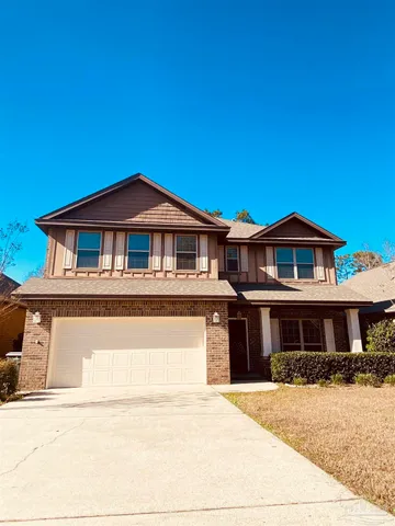 a front view of a house with yard