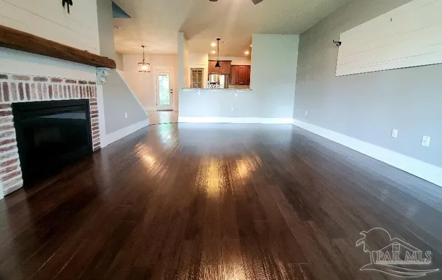 a view of a living room with wooden floor