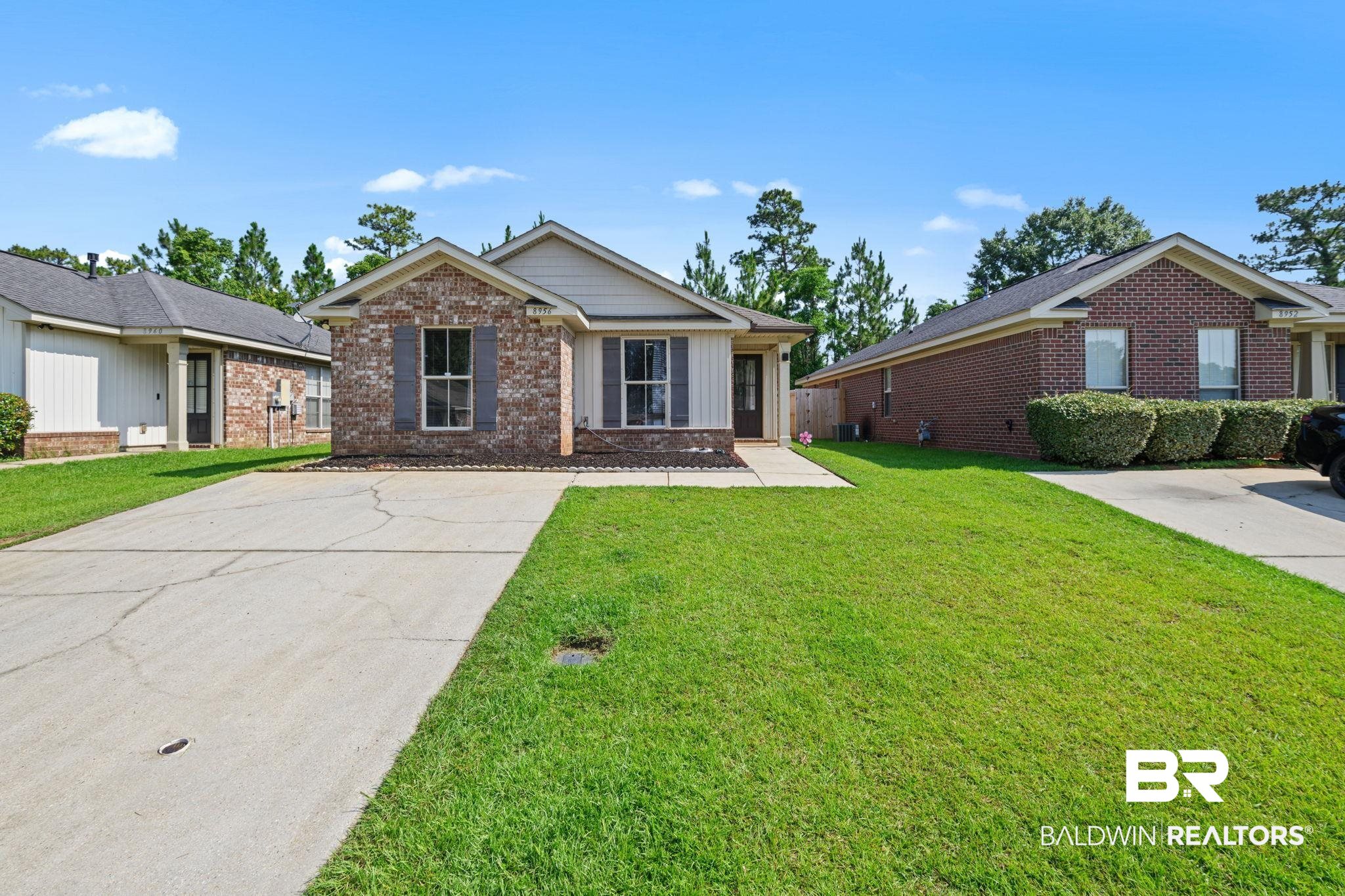 8956 Spring Grove North Mobile, AL 36695 - Photo 1 of 19 Ranch-style house featuring brick siding and a front lawn