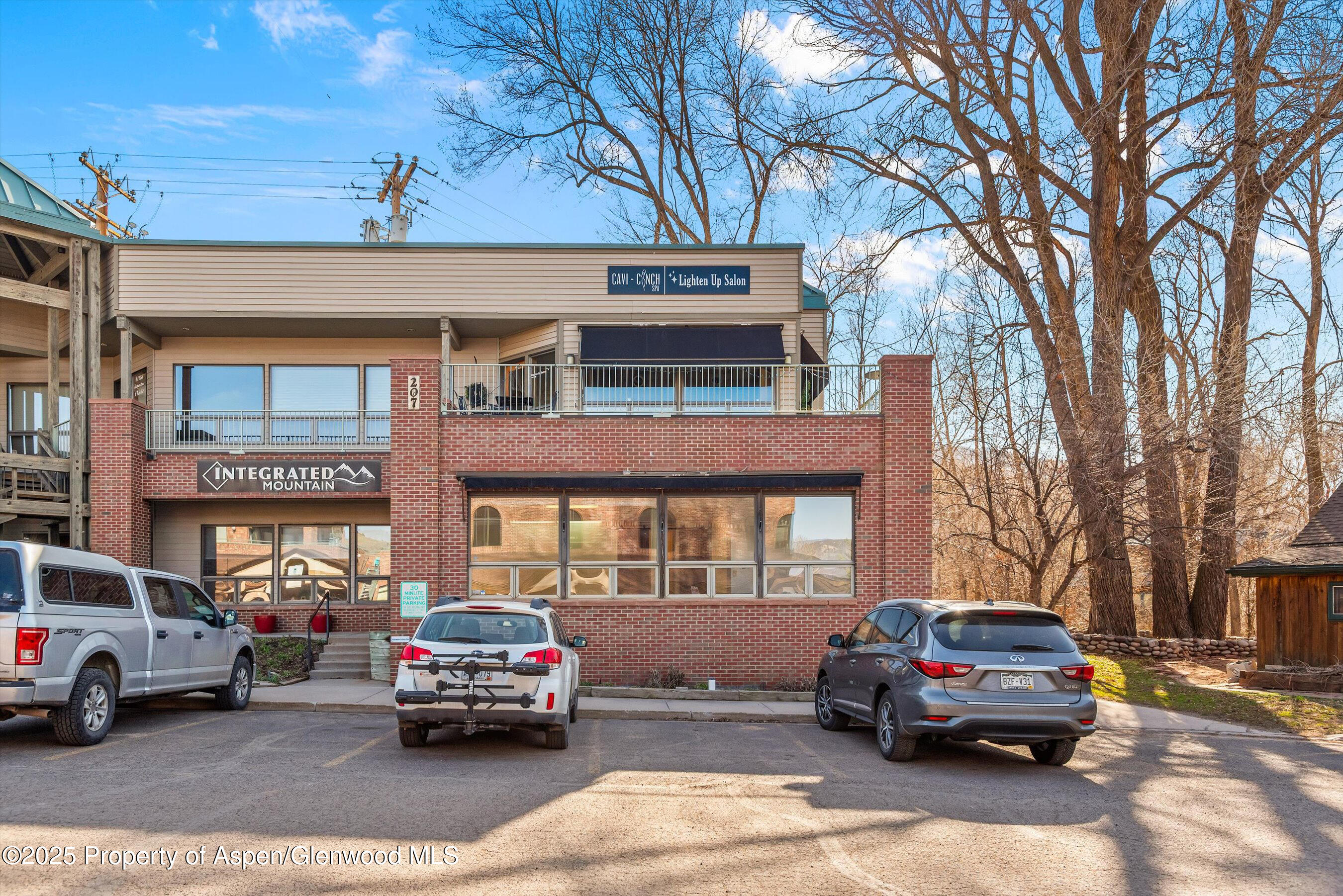 207 Basalt Center Circle, Unit 104 Basalt, CO 81621 - Photo 2 of 13 a car parked in front of a building