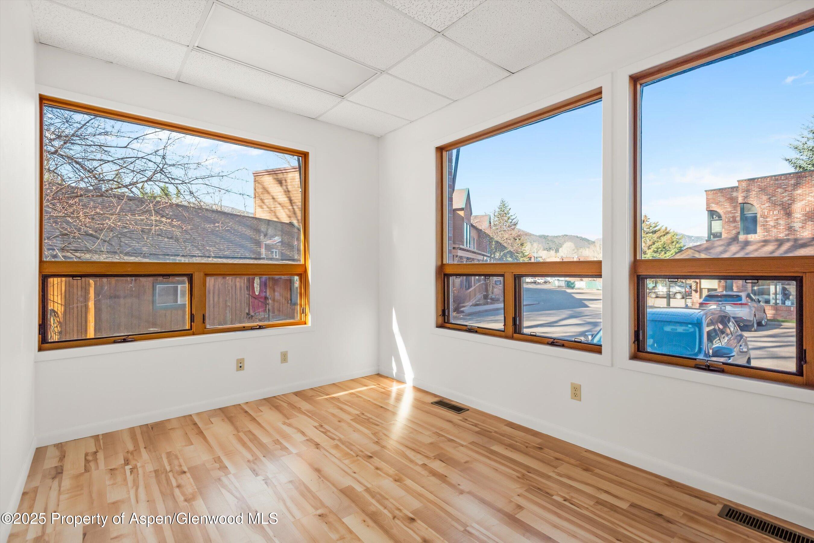 207 Basalt Center Circle, Unit 104 Basalt, CO 81621 - Photo 8 of 13 a view of empty room with a large window